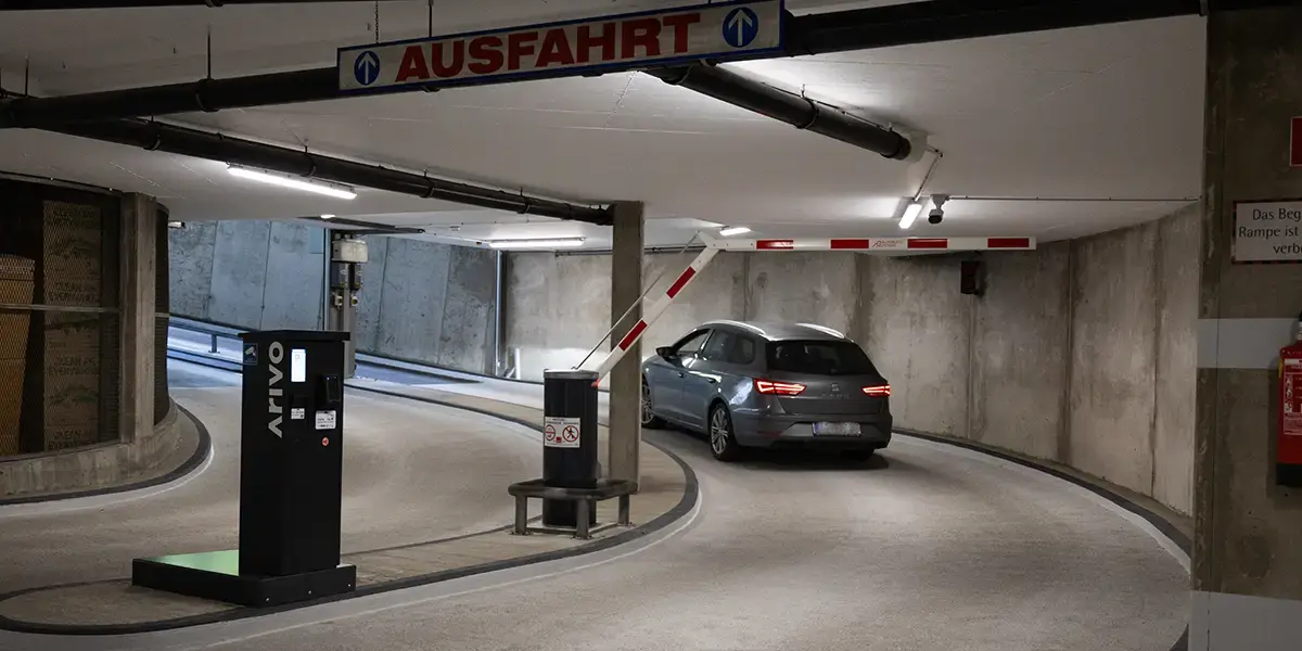 Underground car park exit with barriers & parking system from Arivo at the Metahoft underground car park in Graz